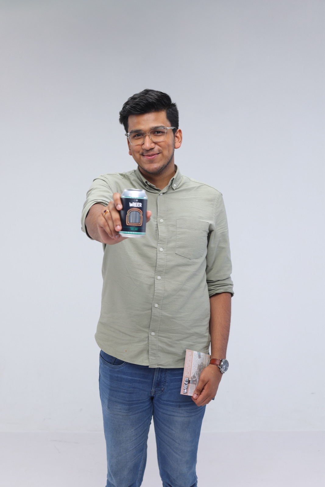 Naman Tekriwal holding a can of Breer in studio